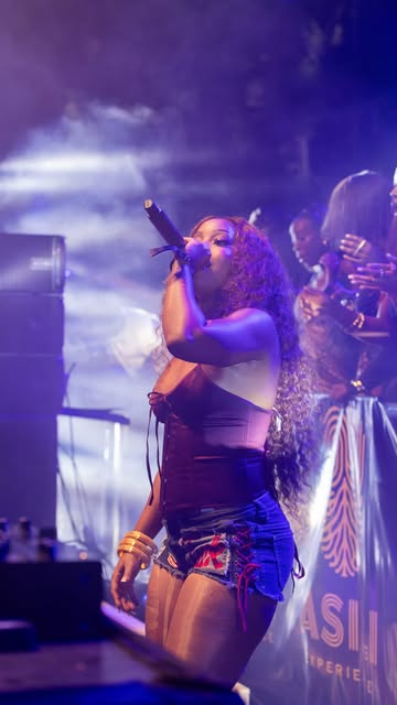 Asili performer on stage